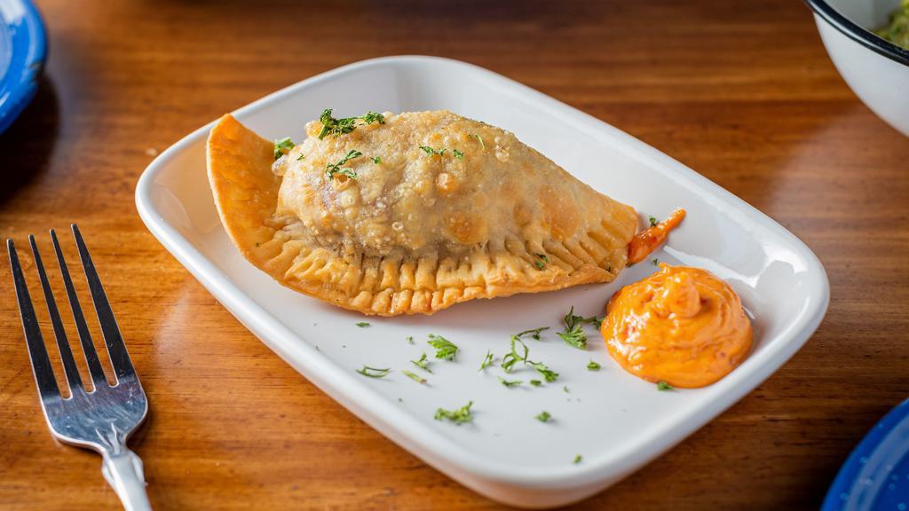 Empanadas (Single) · Crispy pastry turnovers filled with: beef, chicken or cheese served with tomato aioli.
