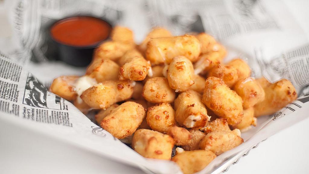 Beer Battered Wisconsin Cheese Curds · A state fair favorite perfected at Burger Moe's! Served with house-made marinara sauce.