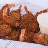 Coconut Shrimp · Hand-breaded butterfly shrimp, golden fried to perfection & served with pina colada sauce.