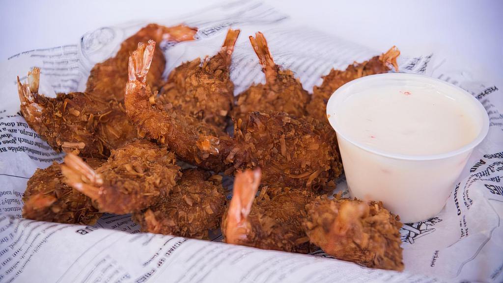 Coconut Shrimp · Hand-breaded butterfly shrimp, golden fried to perfection & served with pina colada sauce.