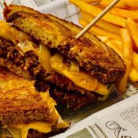 Patty Melt Burger · American and Swiss cheeses & caramelized onions on marble rye bread.