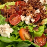 Avocado Wedge Salad  · Boston bibb wedge salad, hickory smoked bacon, bleu cheese crumbles, grape tomatoes, avocado...