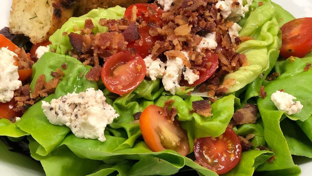 Avocado Wedge Salad  · Boston bibb wedge salad, hickory smoked bacon, bleu cheese crumbles, grape tomatoes, avocado, house ranch dressing.