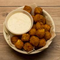 Cheeseballs · Deep fried cheddar cheese balls served with ranch dipping sauce.