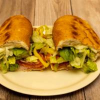 Regular Italian Sub · Ham, salami, pepperoni and provolone cheese topped with lettuce, tomato, hot banana pepper a...