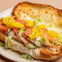 Turkey Sub · Sliced turkey and provolone cheese topped with lettuce, tomato, hot banana pepper and Italia...
