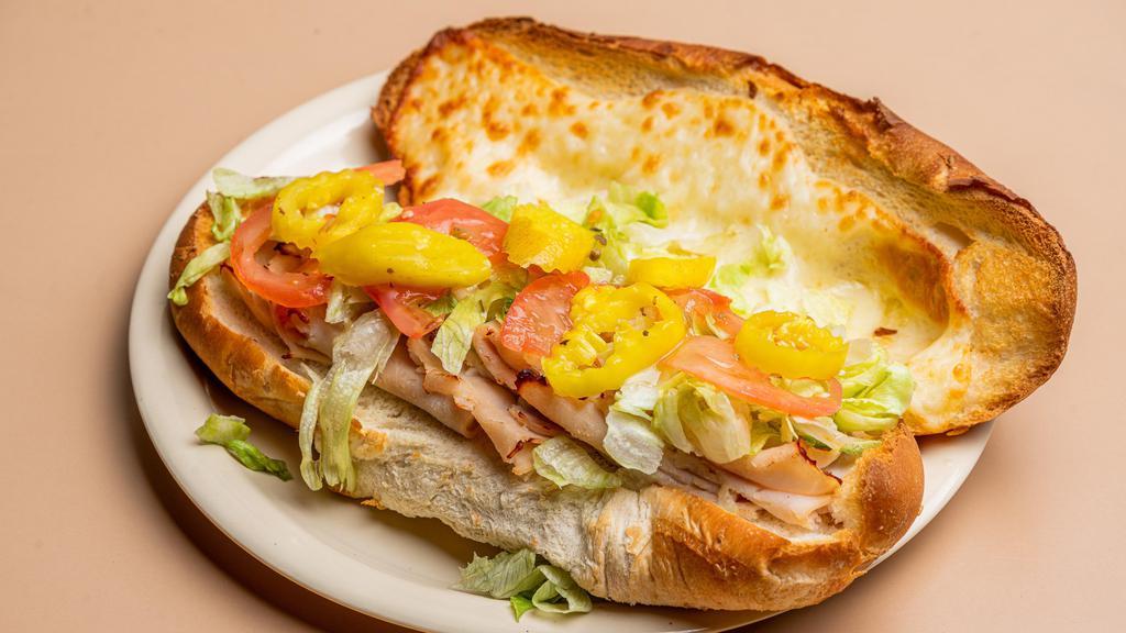 Turkey Sub · Sliced turkey and provolone cheese topped with lettuce, tomato, hot banana pepper and Italian dressing.