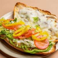 Vegetarian Sub · Mushroom, green pepper, onion and provolone cheese topped with lettuce, tomato, hot banana p...