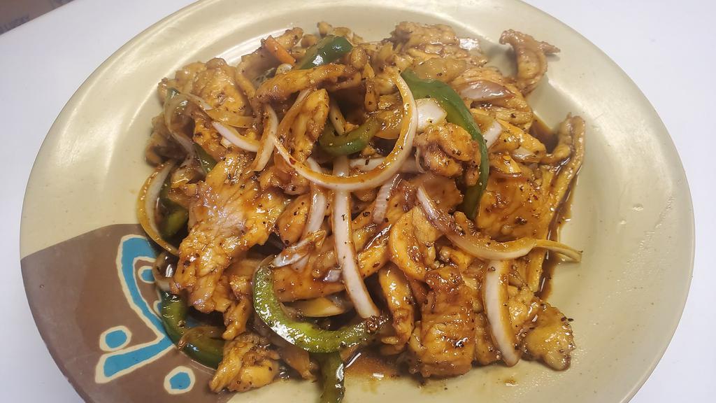 Black Pepper Chicken · Chicken breast tossed in black pepper then stir-fried with green onion, carrots, onion, and green peppers in a spicy sauce.