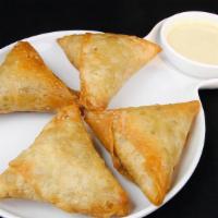 Chicken Samosa · Best seller. Pastry shells stuffed with savory minced chicken.