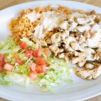Arroz Con Pollo · Served with rice and beans.
