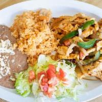 Chicken Fajitas · Sauteed with onions, tomatoes, bell peppers, and tortillas. Served with rice and beans.