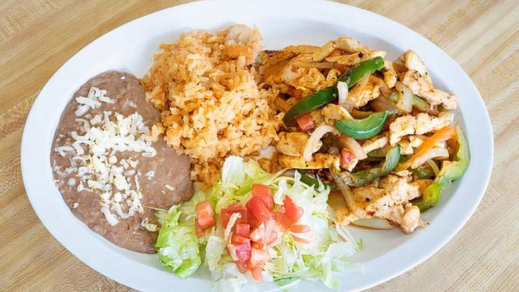 Chicken Fajitas · Sauteed with onions, tomatoes, bell peppers, and tortillas. Served with rice and beans.