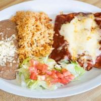 Enchiladas Supremas · Four enchiladas stuffed, one chicken, one beef, one cheese, and beans. Served with rice and ...