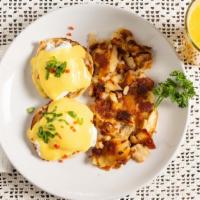 Eggs Benedict · 2 poached eggs on a toasted English muffin with Canadian bacon and topped with hollandaise s...