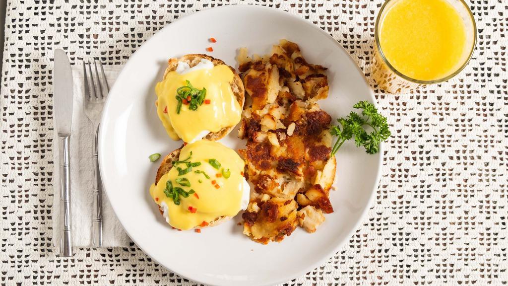 Eggs Benedict · 2 poached eggs on a toasted English muffin with Canadian bacon and topped with hollandaise sauce