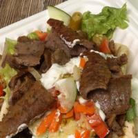 Gyro Sandwich · Pita bread - Gyro meat, grilled onions, cucumber sauce, tomatoes, and lettuce (spicy by requ...