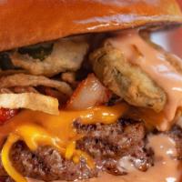 The Old Town Road · Half-pound beef patty, yellow cheddar, bacon, hand-breaded fried jalapenos & onions, BBQ aio...
