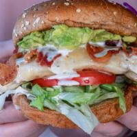 Chicken Bacon Club · Grilled chicken breast topped with bacon, cheddar, lettuce, tomato, smashed avocado, and ran...