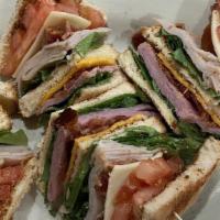 Freeway Club Sandwich · Shaved ham, turkey, bacon lettuce and tomato with American cheese and mayo on toast.