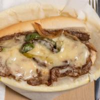 Philly Cheese Steak · Thinly sliced ribeye steak with fried onions, green peppers, and cheese.