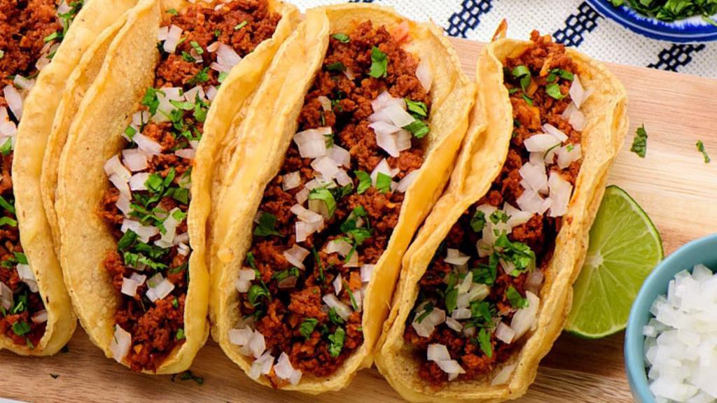 Chorizo Tacos · 3 Tacos filled with spicy Mexican sausage, topped with cilantro, onions and your favorite home made salsa. Lime on the side.