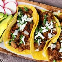 Carne Molida Tacos  · 3 Tacos filled with ground beef, topped with cilantro, onions and your favorite home made sa...