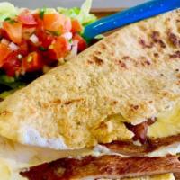 Mexican Quesadilla · Hand made corn tortilla  folded in half and filled with cheese and your favorite meat. Serve...