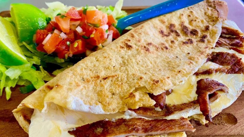 Mexican Quesadilla · Hand made corn tortilla  folded in half and filled with cheese and your favorite meat. Served with rice and beans. Sour cream and avocado salsa on the side.