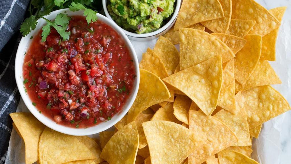 Tortilla Chips · Crunchy homemade corn tortillas cut into triangles and fried. Paired best with one of our homemade salsas or guacamole.