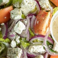 Greek Salad · Lettuce, feta cheese, tomatoes, red onions and Greek dressing.