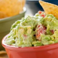 Guacamole · Made in-house with fresh avocados, onion and tomatoes. Served with chips.