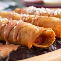 Chipotle Chicken Taquitos · Comes with creamy chipotle salsa topped with sour cream, guacamole and cheese.