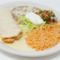 Chimichanga · Stuffed flour tortilla with your choice of chunks of beef or chicken then deep fried to a go...