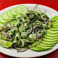 Camarones Aguachile · Shrimp seasoned in the juice of lime, cilantro, and onion with avocado and crackers