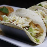 Tacos Veracruz · Three tacos of white fish served with rice and pico de gallo