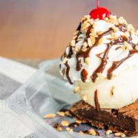 Cheesecake Brownie Sundae · Cheesecake with fudge or caramel sauce topped with whip cream, nuts and cherry.