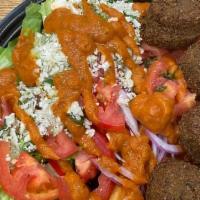 Vegging Out · falafel, garlic hummus, romaine, forbidden black rice, peppers, tomatoes, onions, raw cauilf...