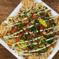 Levantchos · Try our Mediterranean inspired take on the classic nacho platter. Pita, Protein, Veggies and...