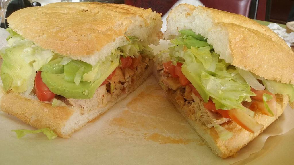 Torta · Torta con tu seleccion de carne, lechuga, tomate, aguacate, crema y frijoles. Cada. / Mexican bun filled with your choice of meat, lettuce, tomato, avocado, sour cream and beans. Each.