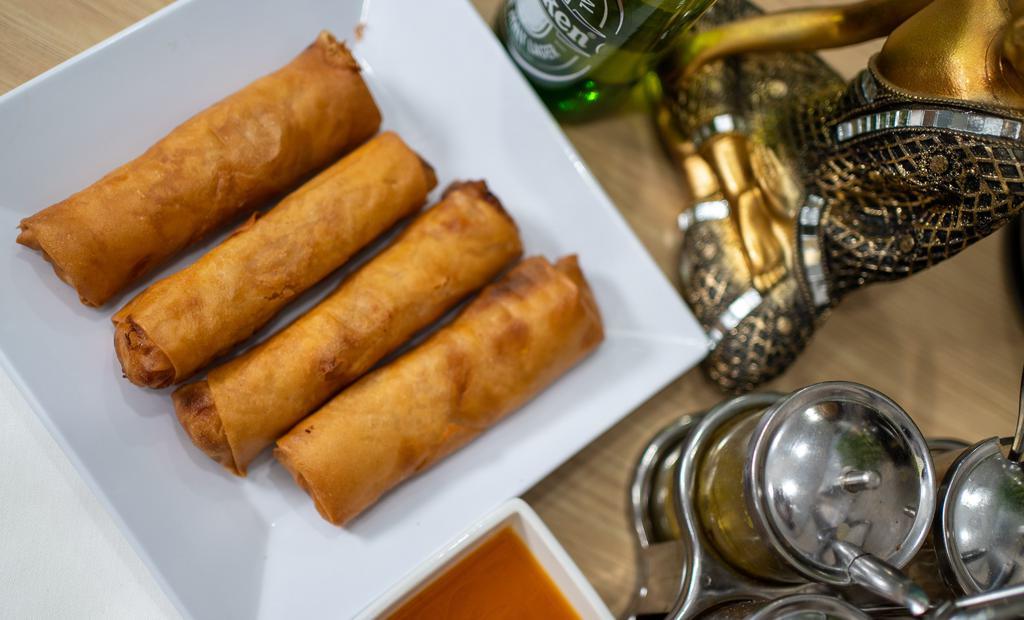 Fried Egg Rolls · Four fried spring rolls stuffed with pork, silver-thread noodles with veggies.