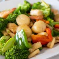 Seafood Delight · Shrimp, scallops, and stir-fired broccoli, red & green bell pepper, carrot, and onion in bro...