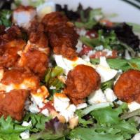 Buffalo Chicken Salad · Fried chicken, bleu cheese crumbles, tomatoes, hard boiled eggs on mixed greens with a buffa...