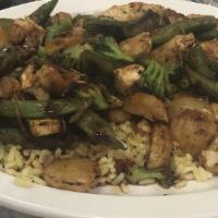 Chicken Stir-Fry · Seasoned breast sauteed with vegetables over rice