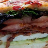 Chicken Avocado Club · Juicy Chicken Breast, Avocado Slices, Applewood Smoked Bacon, Baby Greens, Pesto Mayonnaise ...