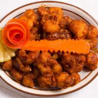 Chili Chicken Dry · Chicken cooked in fairly hot sauce pepper & onion.