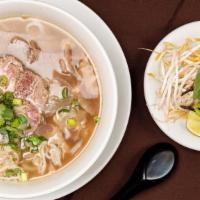 Vkitchen Pho · Beef noodle soup with sliced rare steak, sliced brisket, tripe, tendon, and meatball. Topped...