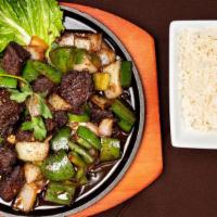 Shaking Beef · Cubed beef sautéed with onion, pepper, and soy sauce.