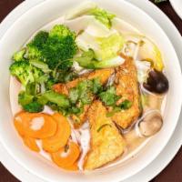 Vegan Pho · Vegan. Veggie pho noodle soup with vegetables, mushroom, and tofu; topped with cilantro, oni...