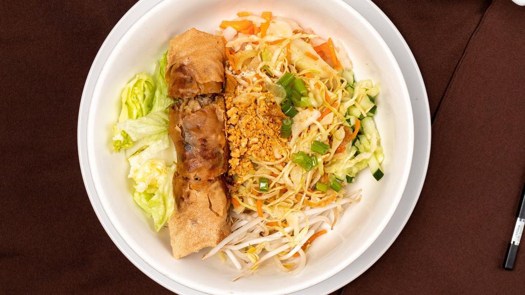 Vegan Vermicelli Bowl · Vegan. Vermicelli noodles are served dry and at room temperature, layered with shredded lettuce, bean sprout, pickled carrot and daikon, fresh cucumber; topped with veggie egg roll, shredded tofu, cabbage and carrot, roasted peanuts, onion, served with vegan sweetened sauce.